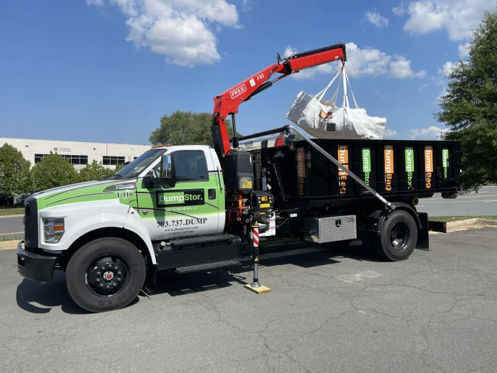 Dumpbag being loaded into a truck